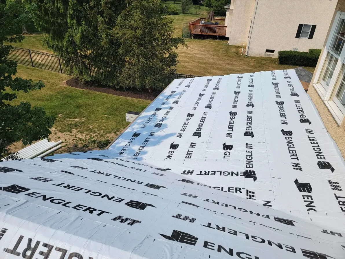 Modern house with new roof and neutral vinyl siding
