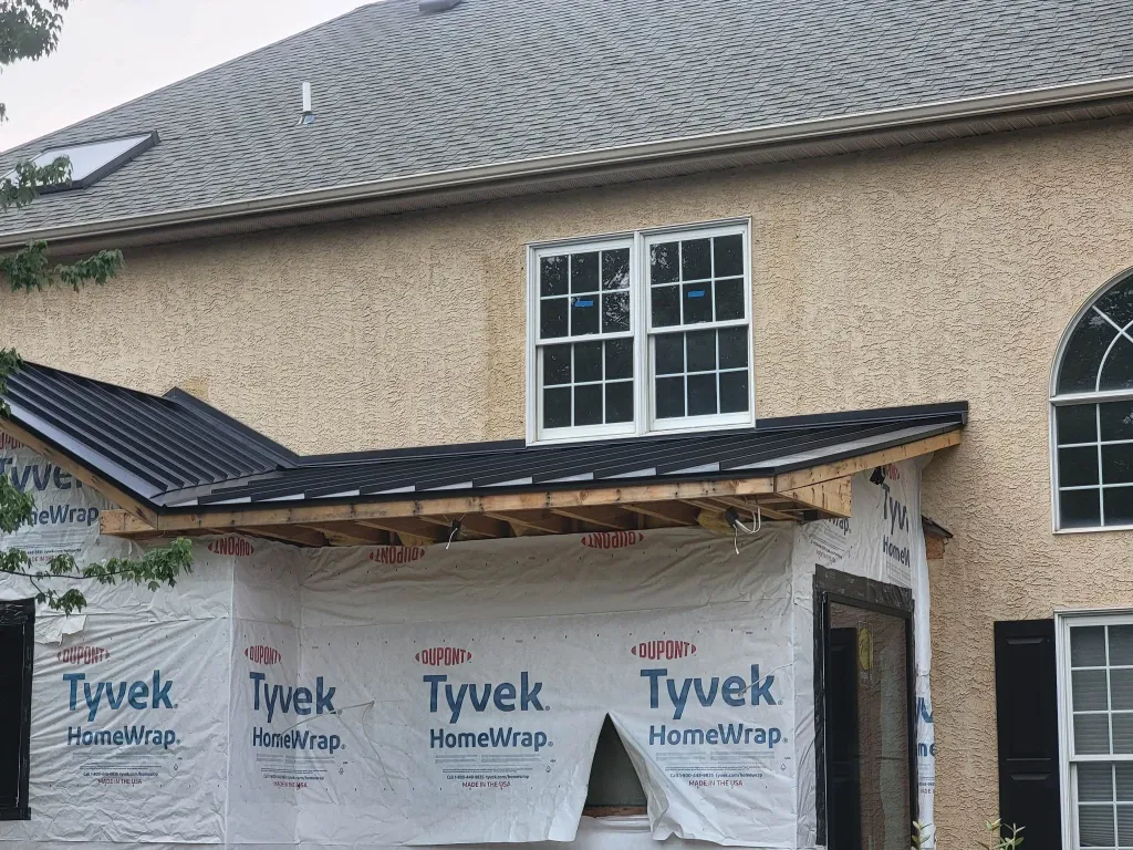 Modern house with new roof and light vinyl siding